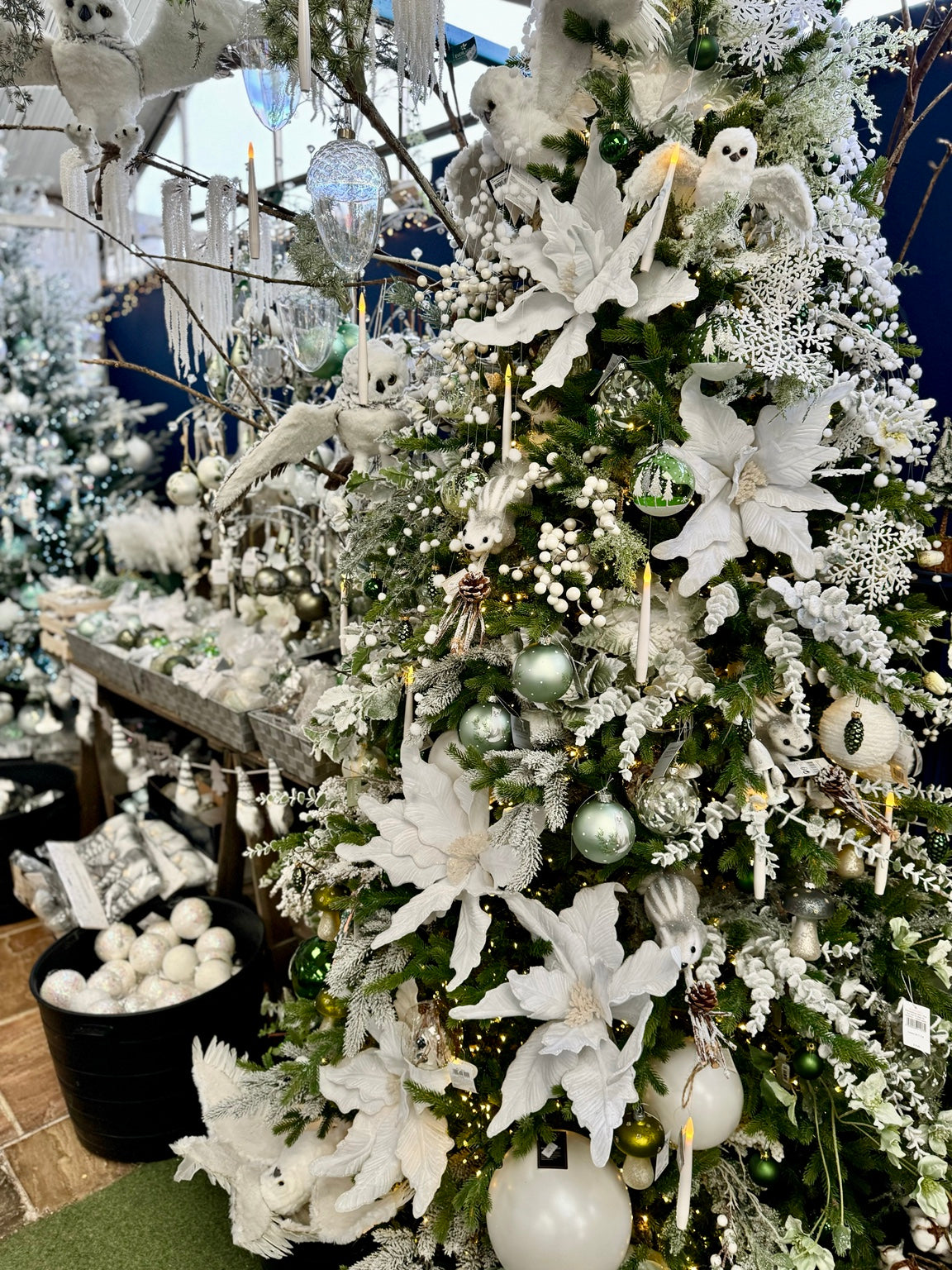 Winter white Christmas styling with frosted ornaments and snowy decorations