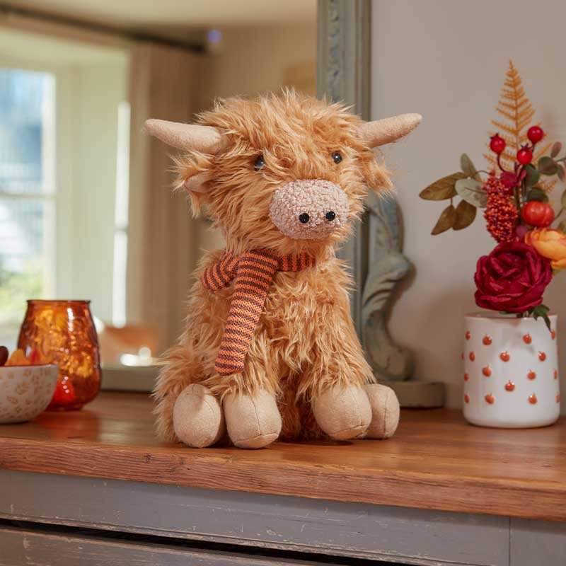 Seated Highland Cow