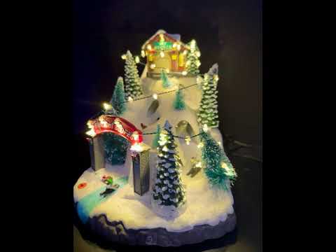 LED Snowy Moving Ski Christmas Village Scene - 34cm